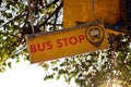 Chiang Rai, Thailand - December 17, 2017: Inscription and sign Ã¢â¬ËBus stopÃ¢â¬â¢ on a yellow banner.